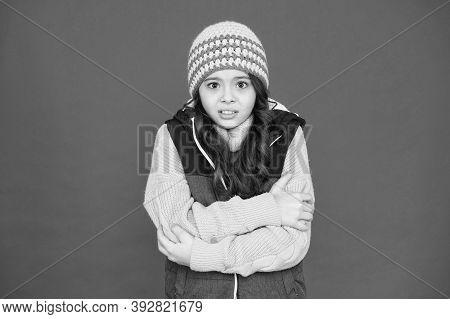 It Might Be Too Cold To Trek Outside. Little Child Feel Cold Red Background. Small Girl Shiver In Co