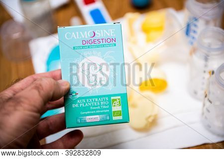 Paris, France - Oct 27, 2020: Male Hand Holding Calmosine Digestion For Babies Manufactured By Labor