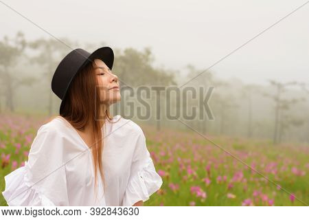 Portrait Of A Woman Relaxing In The Garden Siam Tulip