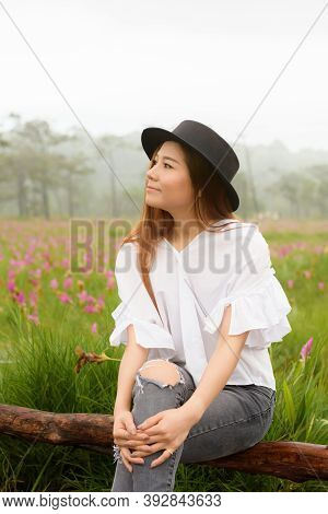 Portrait Of A Woman Relaxing In The Garden Siam Tulip
