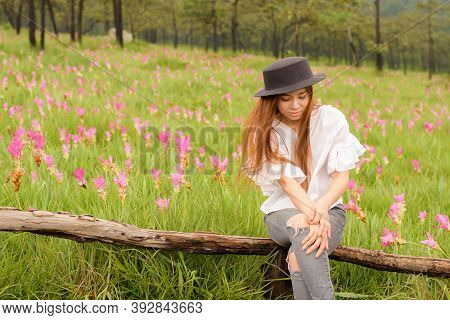 Portrait Of A Woman Relaxing In The Garden Siam Tulip