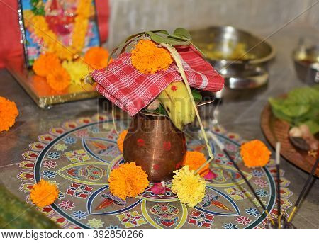Copper Vessel Also Called As Kalash In Hindi Language With Banana, Marigold Flower And Leaf Used Dur