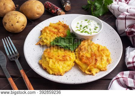 Fried Cakes Of Grated Potatoes On The Plate With Sauce. Traditional Pancakes Boxty Raggmunk.