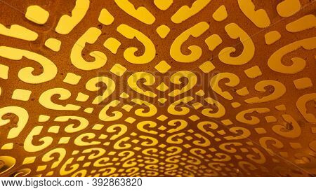 Decorative Gold Pattern Close-up On The Whole Background. Arabic Carved Table Lamp From The Inside. 