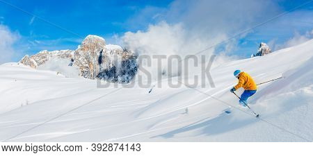 Skiing with amazing panorama of Pale di Sant Martino di Castrozza, Dolomites mountain, Italy