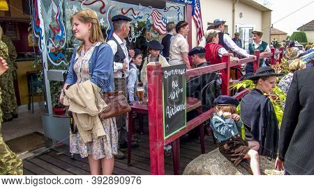 Sainte Mere L'eglise, France - June 6, 2019. Parade Of People Dressed Up In 1940's Clothing Posing I