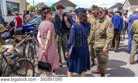 Sainte Mere L'eglise, France - June 6, 2019. Parade Of People Dressed Up In 1940's Clothing Posing I