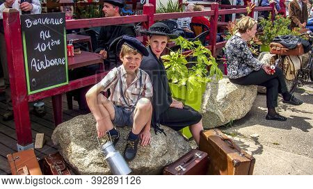Sainte Mere L'eglise, France - June 6, 2019. Parade Of People Dressed Up In 1940's Clothing Posing I