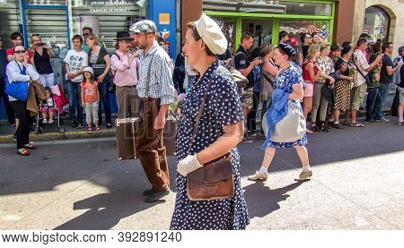 Sainte Mere L'eglise, France - June 6, 2019. Parade Of People Dressed Up In 1940's Clothing Posing I