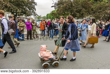 Sainte Mere L'eglise, France - June 6, 2019. Parade Of People Dressed Up In 1940's Clothing Posing I
