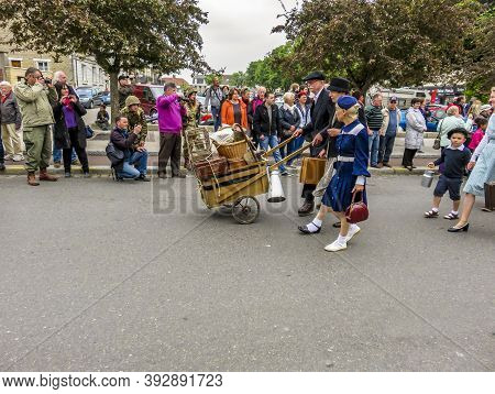 Sainte Mere L'eglise, France - June 6, 2019. Parade Of People Dressed Up In 1940's Clothing Posing I