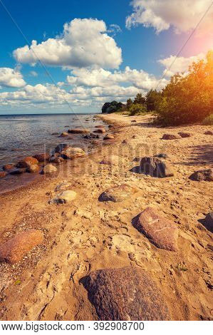 Baltic Sea Coast. Stone Boulders On The Beach