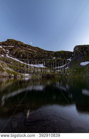 Moon Over The Lake At Dusk On A Clear Summer Night, Switzerland