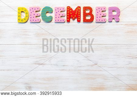 Wooden Letters Written December Month On Vintage Background. Inscription December With Copy Space. T