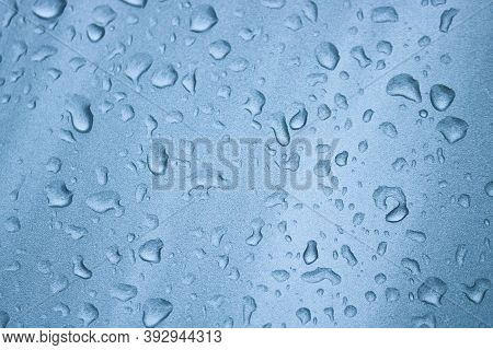 Raindrops On The Silver-blue Surface Of The Car. Selective Focus.