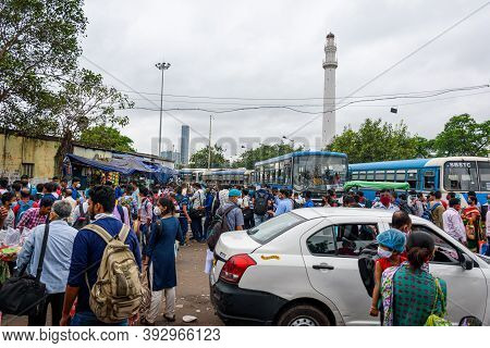 People Gathered In The Bus Stand Waiting For The Bus With Masks During Unlock Period In Kolkata, Wes