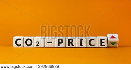 Symbol For An Increasing Co2 Price. Cubes Form The Expression 'co2-price'. Beautiful Orange Backgrou