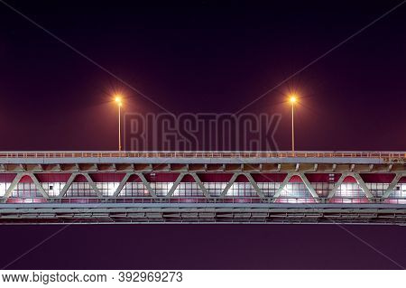 Night Rapid Transit Bridge Lighting. Minimalistic Light, Copy Space. Two Lamppost With Yellow Lighte