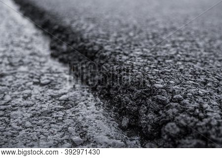 A Large Layer Of Fresh Hot Asphalt. Layer Of Asphalt Raw Material In A Shallow Depth Of Field. Rolle