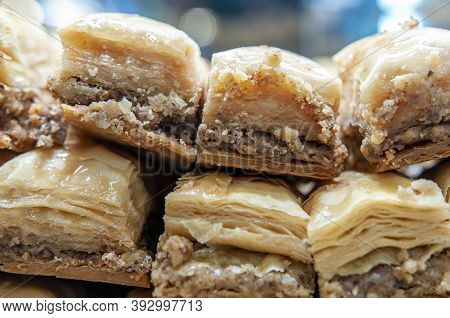 Baklava Pieces On Display. Rich, Sweet Pastry Made Of Layers Of Filo Filled With Chopped Nuts, Sweet