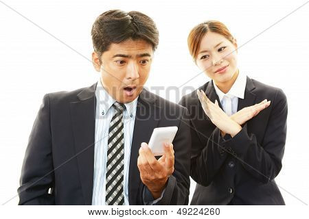 Dissatisfied businessman and businesswoman