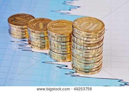 Uptrend Stacks Coins,on The Financial Stock Charts As Background. Selective Focus