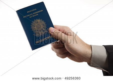 Holding A Brazilian Passport.