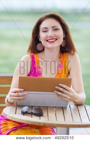 Young Lady Planning In Her Organizer