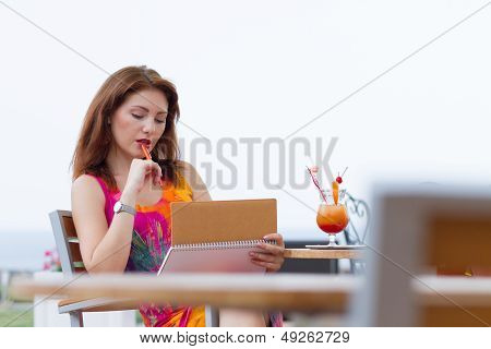 Young Lady Planning In Her Organizer