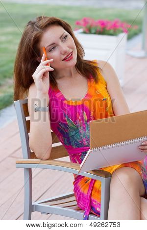Young Lady Planning In Her Organizer