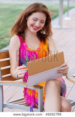 Young Lady Planning In Her Organizer