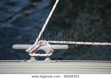 Detail Image Of Yacht Rope Cleat On Sailboat Deck