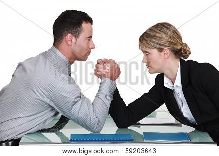 Colleagues having an arm wretle