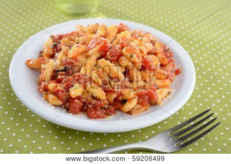 Capunti with Parmesan cheese and tomato sauce