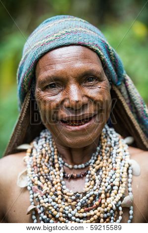PAPUA, NEW GUINEA - OCTOBER 26: A woman of a Ji-Paiya-Kutumb Tribe of Papua New Guinea in traditional clothing on October 26, 2013. 