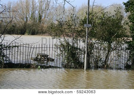 Flooded playing field and car park.