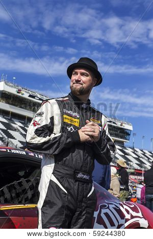 Daytona Beach, FL - Jan 24, 2014:  Jim Jonsin signs autographs before the start of the BMW Performance 200 at Daytona International Speedway in Daytona Beach, FL.