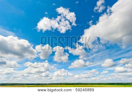 Beautiful Clouds And Blue Sky Over Field And Fores