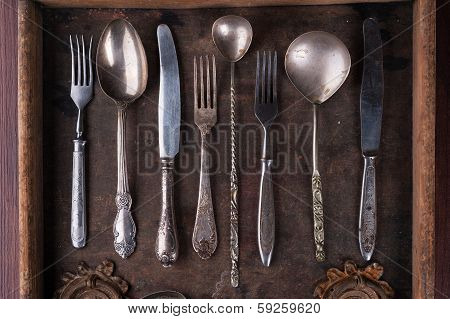 Old Cutlery In An Old Wooden Box