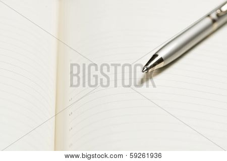 pen and open notepad