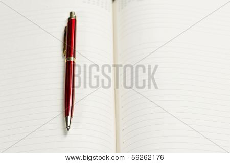 pen and open notepad