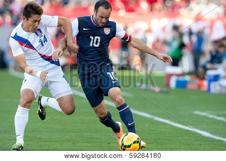 CARSON, CA. - FEB 01: Korea D Yong Lee #14 & USA M Landon Donovan #10 during the U.S. mens national team soccer friendly against Korea Republic on Feb 1st 2014 at the StubHub Center in Carson, Ca.