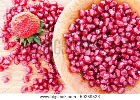 Pomegranate Seeds With A Strawberry