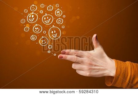 Group of happy hand drawed smiley faces coming out of gun shaped hands