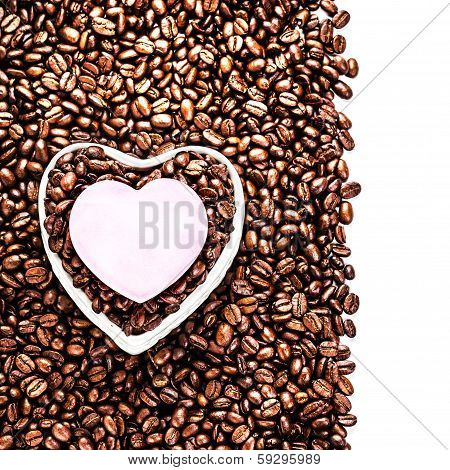 oasted Coffee Beans with Heart Shaped Paper Sheet over coffee bean