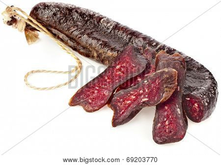 dried solid sausages sudzhuk isolated on white background