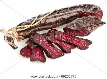 dried solid sausages sudzhuk isolated on white background
