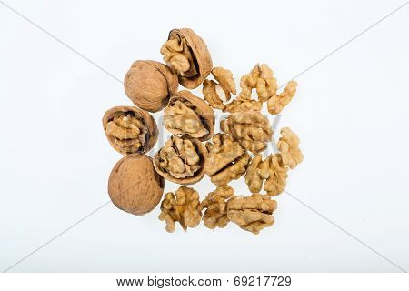 walnut and a cracked walnut isolated on the white background