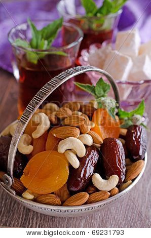 Almonds, Dried Apricots, Cashews, Dates, Lying In A Metal Bowl