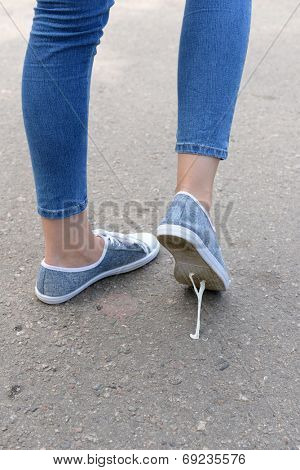 Foot stuck into chewing gum on street